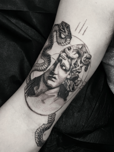 A black and grey realism tattoo of Medusa on the inner arm, featuring detailed snakes and a classical portrait style — by tyler_whitlock, los angeles