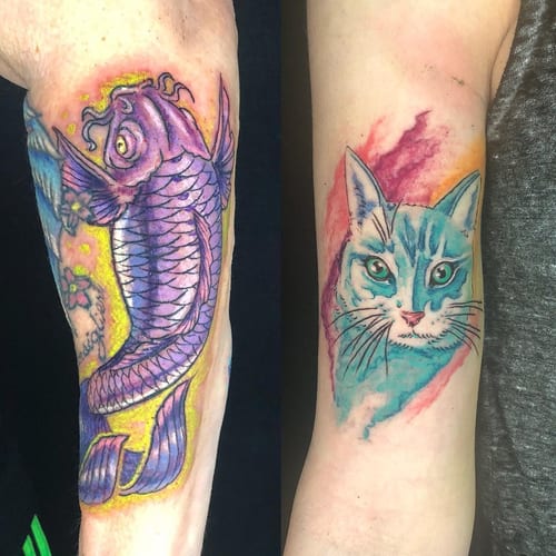 A colorful new school tattoo featuring a purple koi fish and a watercolor-style cat on the forearm — by Sandra Price, los angeles