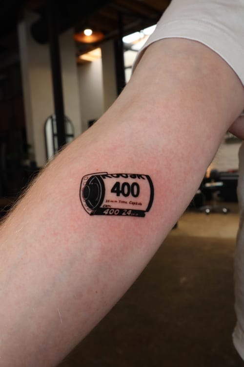 minimalist film roll tattoo — by Vince Espinoza, los angeles