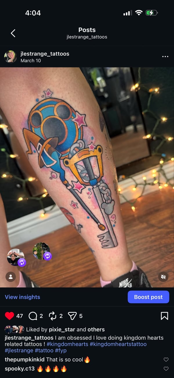 A colorful illustrative tattoo on the leg featuring a stylized sword and heart with vibrant colors and bold outlines — by Jessica Linden, riverside, ca