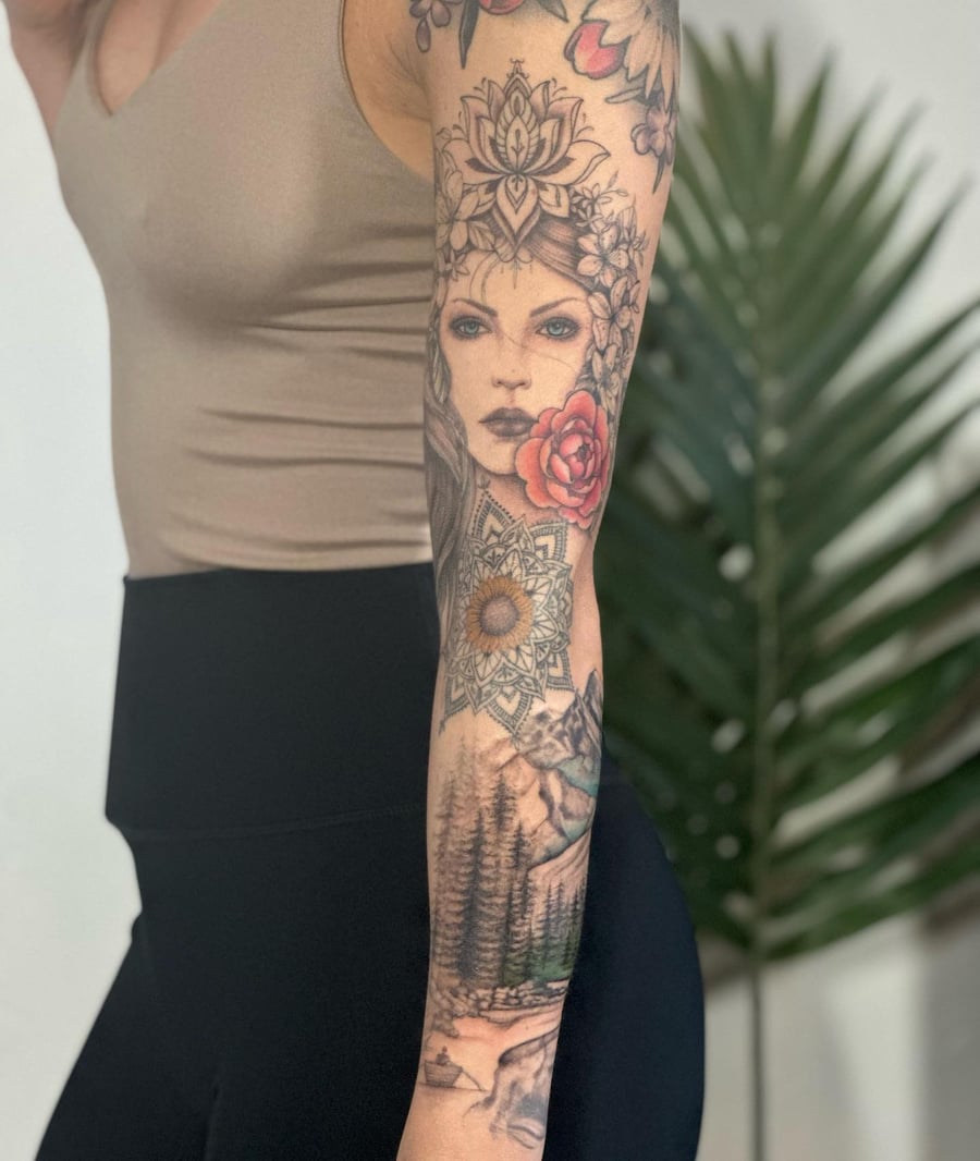 A realistic and colorful woman's portrait tattoo on the arm, featuring floral and landscape elements in an illustrative style — by Melanie Benoit, los angeles