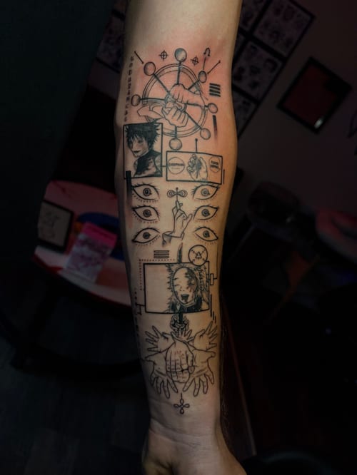 A black and grey illustrative tattoo on the forearm featuring a series of eyes, hands, and a portrait with intricate linework — by Vince Espinoza, los angeles