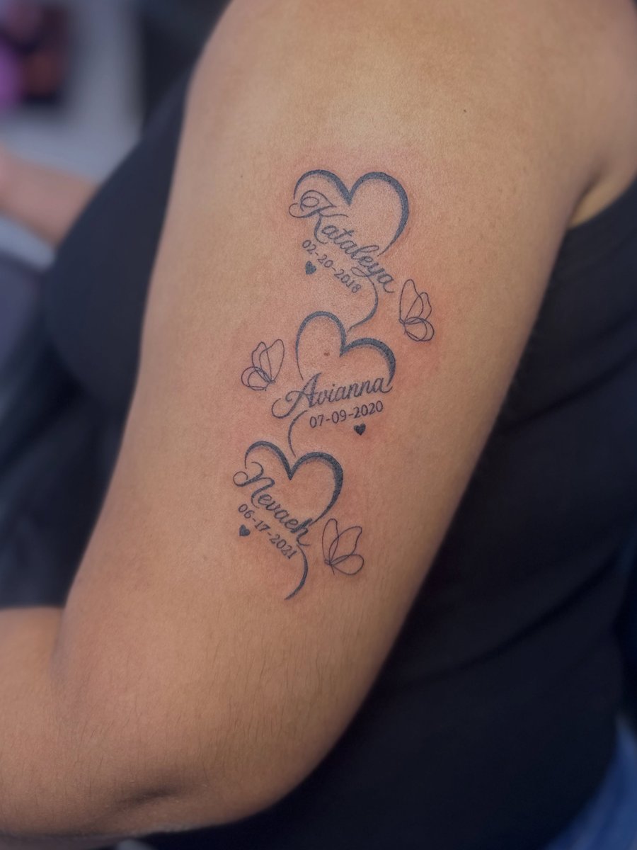 A minimalist tattoo of hearts with names and dates on the arm — by Maddie Ramirez, los angeles