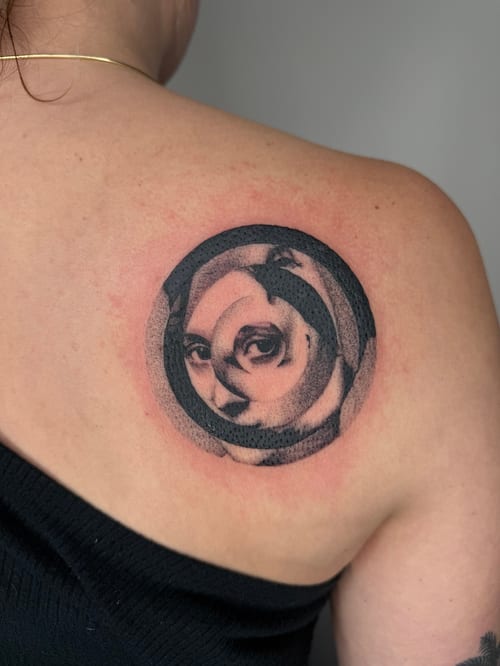 black & grey woman's face in spiral tattoo — by Level tattoo, los angeles