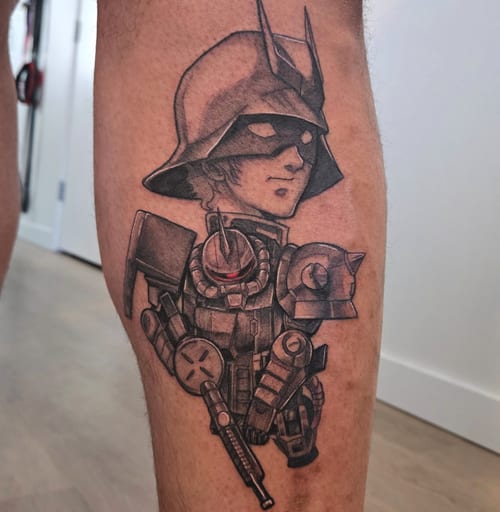 A black and grey anime-style portrait tattoo on the leg, featuring a character in a helmet with detailed shading and linework — by Dretty, los angeles