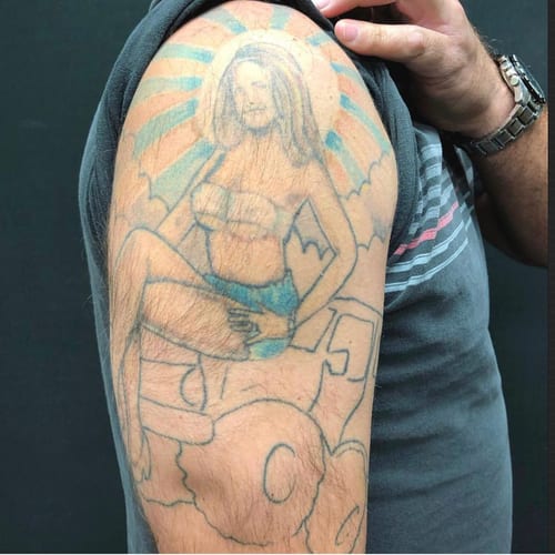 A colorful illustrative tattoo of a woman sitting on a cloud, located on the upper arm — by Sandra Price, los angeles