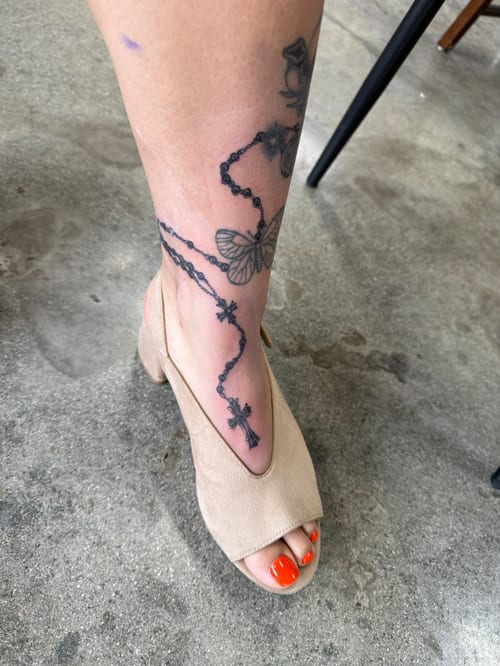 blackwork butterfly and chain tattoo — by Level tattoo, los angeles