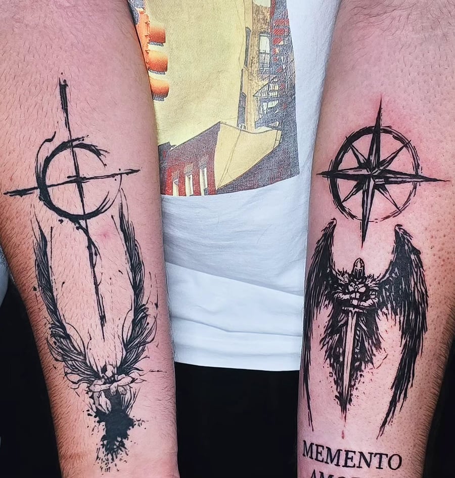 A black and grey tattoo featuring an angel with a sword and compass on the forearm, done in a graphic blackwork style — by Miguel ANGELO, los angeles