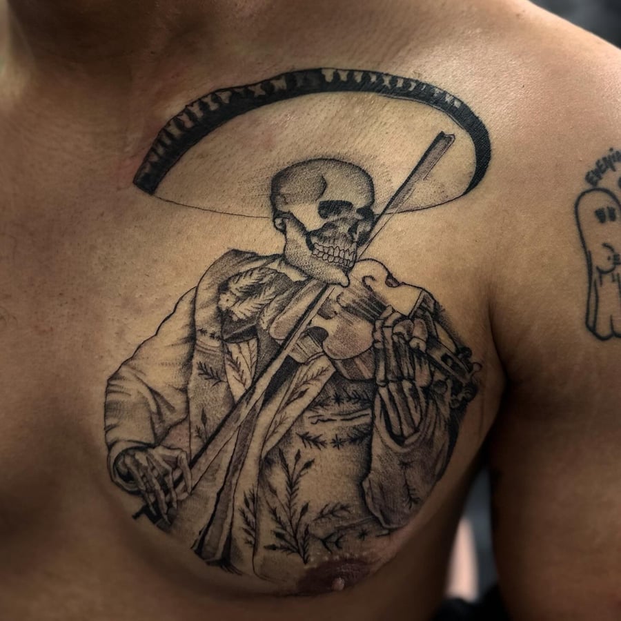 A black and grey skeleton mariachi playing a violin on the chest, done in blackwork and fine line style — by Maddie Ramirez, los angeles