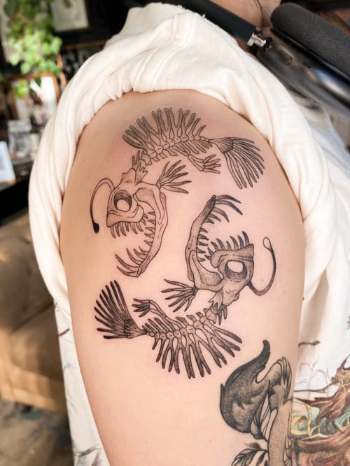 linework angler fish skeletons tattoo — by katlyyons, los angeles