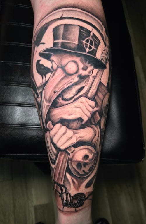 A black and grey Neo-Traditional tattoo on the calf depicting a plague doctor with a top hat, surrounded by crows and skulls, featuring bold lines and dark shading — by Dretty, los angeles