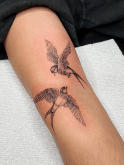 fine line two swallows tattoo — by lunayflorestattoo, los angeles