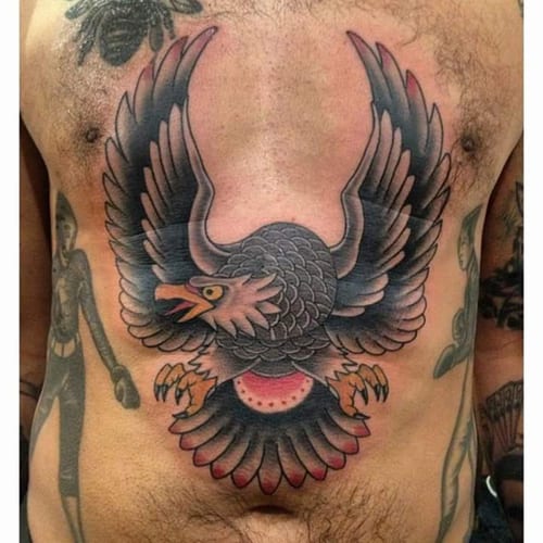 A bold American traditional eagle tattoo on the chest with vibrant colors — by Samuel Connelly, los angeles