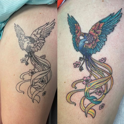 A vibrant and colorful phoenix tattoo on the thigh, featuring ornate feathers and floral accents in an illustrative style — by Sandra Price, los angeles