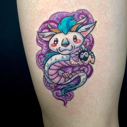 A whimsical and colorful cute dragon tattoo on the leg, featuring a playful design with vibrant colors — by Sandra Price, los angeles