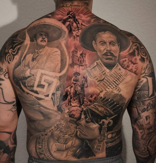 A detailed black and grey tattoo on the back featuring historical figures and scenes with realistic shading and bold imagery — by Johnny Ayala, fontana, ca