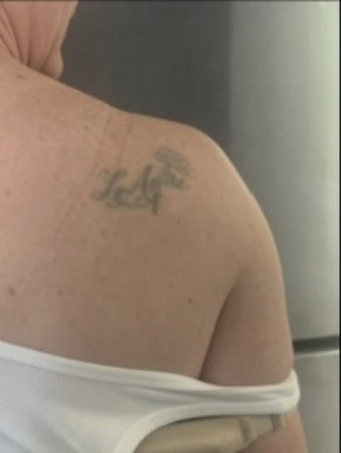 A small minimalist black and grey mushroom tattoo on the shoulder — by Melanie Benoit, los angeles