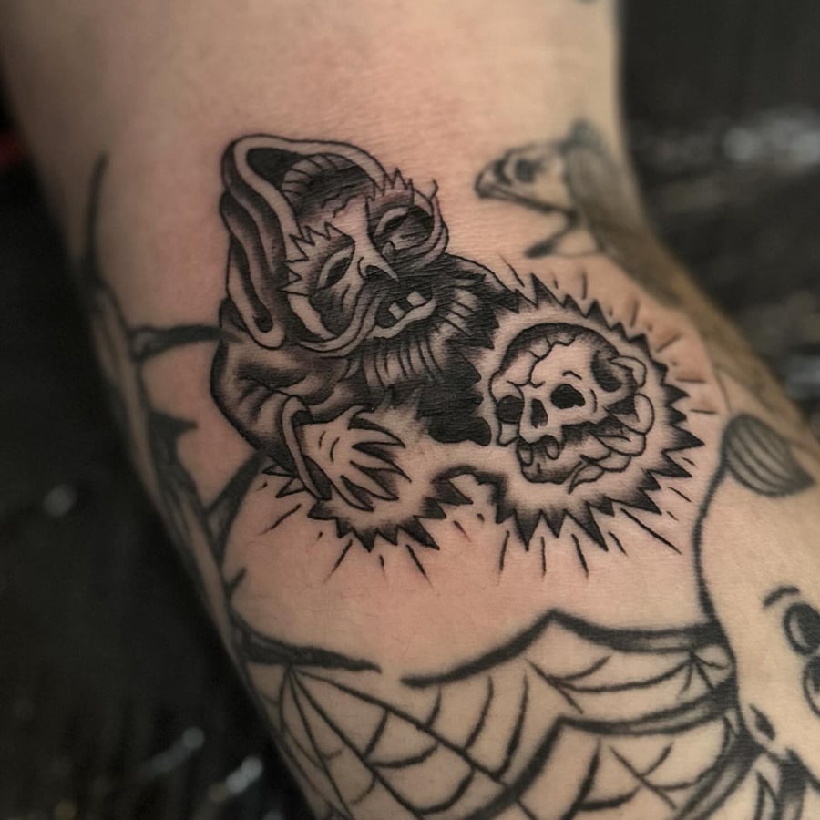 A blackwork tattoo of a grim reaper with a skull, featuring dark and graphic elements — by Maddie Ramirez, los angeles