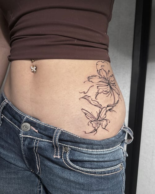 A fine line black and grey tattoo of flowers and butterflies on the hip, featuring delicate outlines and minimal shading — by Shelby Bianco, los angeles
