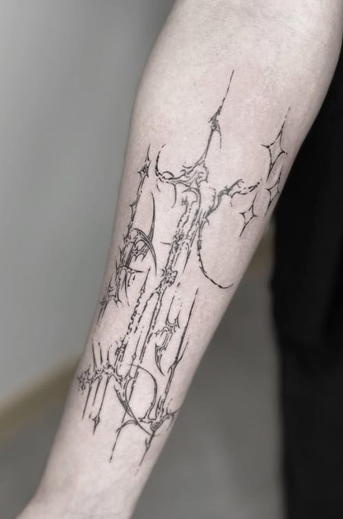 A delicate black linework tattoo on the forearm featuring abstract architectural elements with fine lines and intricate details — by Jian Liang, los angeles