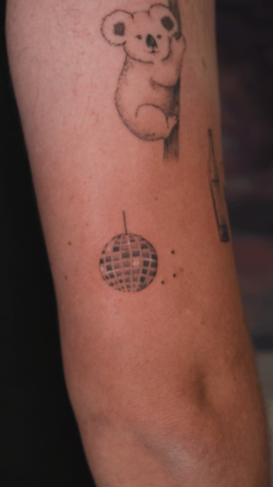 minimalist disco ball tattoo — by Samantha Wilks, los angeles