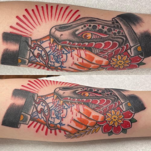 A bold neo-traditional tattoo of a snake wrapped around a hand with colorful flowers on the forearm — by Sandra Price, los angeles