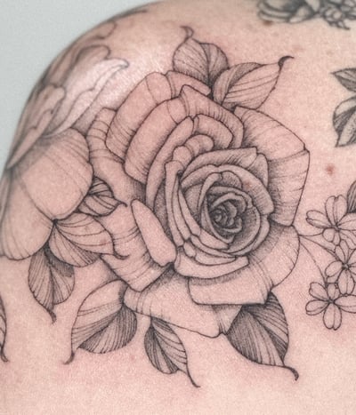 A delicate black and grey rose bouquet tattoo on the shoulder with fine line detailing — by Melanie Benoit, los angeles