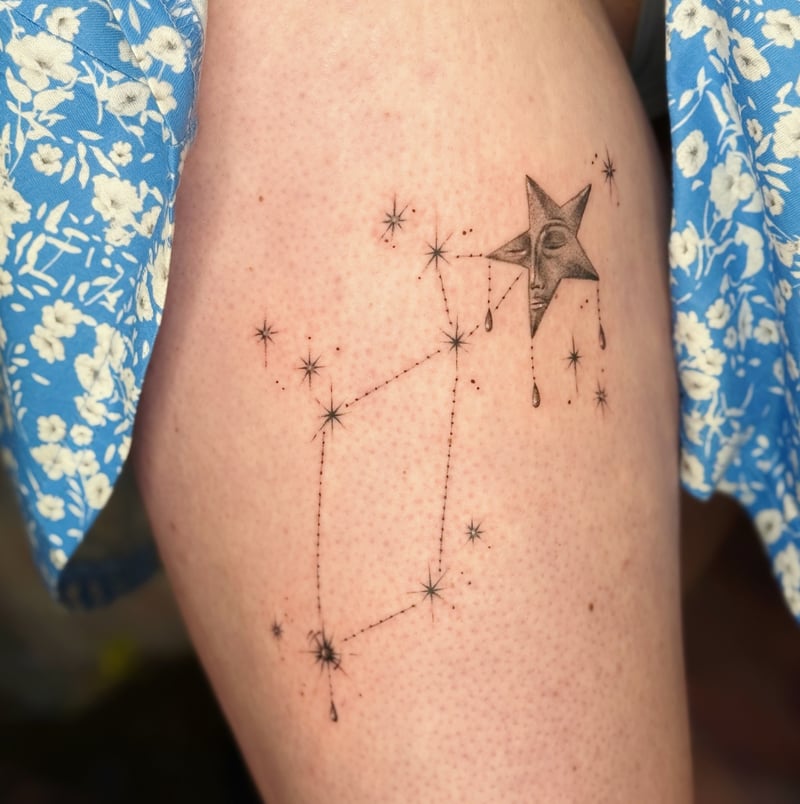 fine-line celestial constellation tattoo with a small crescent-star face by Samantha Wilks, a fine line tattoo artist in downtown los angeles