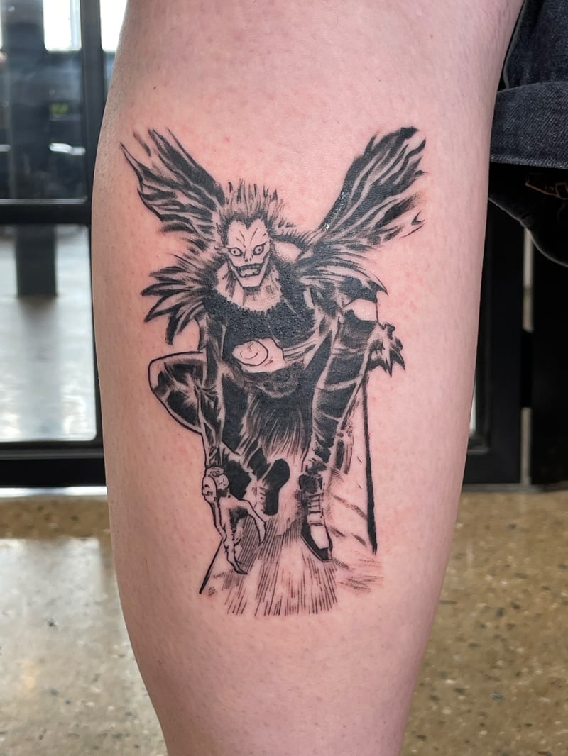 black and grey manga tattoo of Ryuk from Death Note by Vince Espinoza, an anime tattoo artist in los angeles