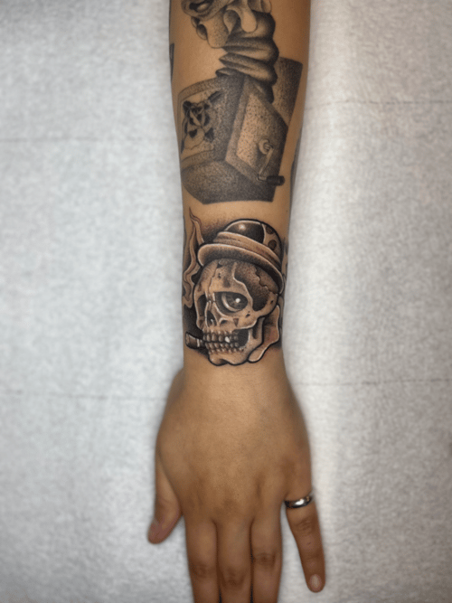 black & grey skull with hat tattoo — by Engram, los angeles