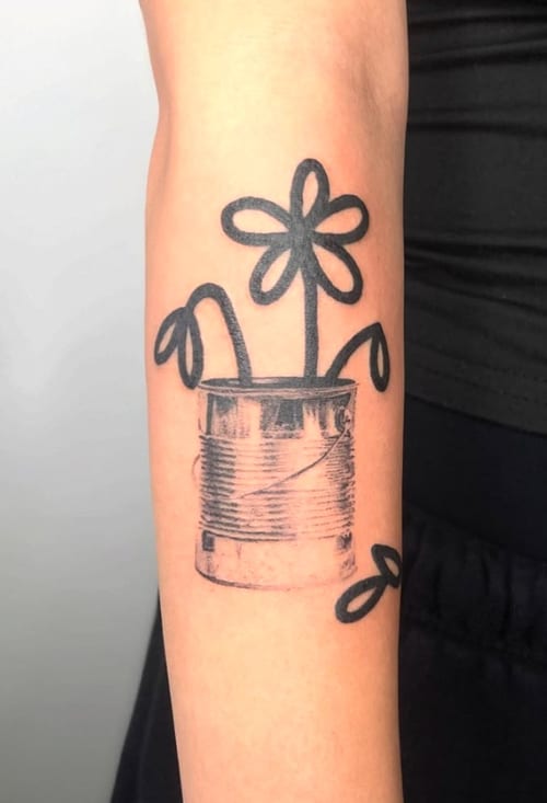 A minimalist black and grey tattoo of simple line-drawn flowers in a tin can on the forearm — by Level tattoo, los angeles