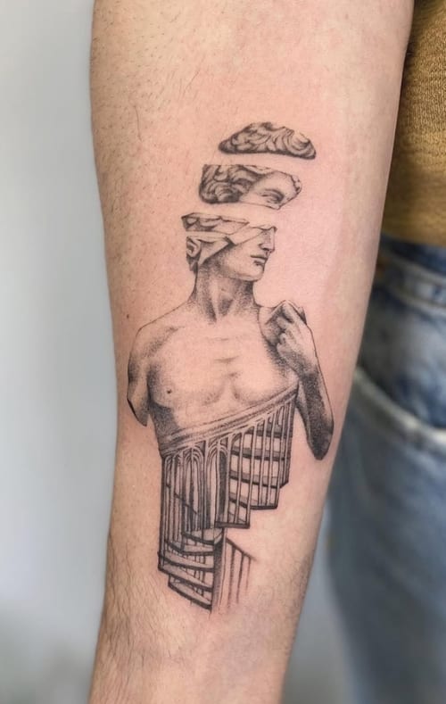 A surreal black and grey tattoo of a fragmented classical statue on the forearm, featuring intricate details and shading — by Jian Liang, los angeles