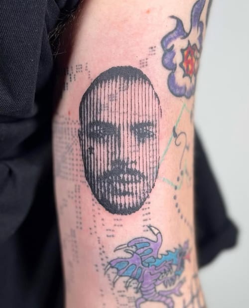 A black and grey linework portrait tattoo on the forearm, featuring vertical lines creating a detailed face image — by Level tattoo, los angeles