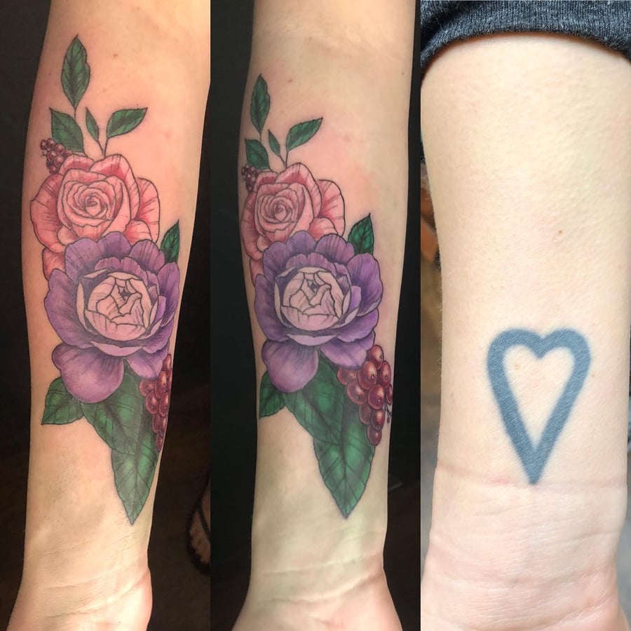 A colorful neo-traditional flower bouquet tattoo on the forearm, featuring purple and pink roses with green leaves — by Sandra Price, los angeles