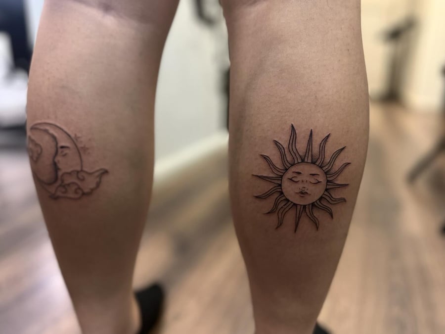A black and grey fine line tattoo of the sun and moon on the calf — by Maddie Ramirez, los angeles