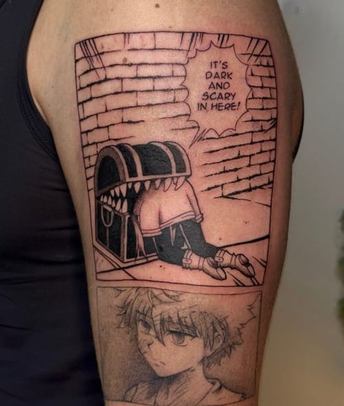 A black and grey anime-style tattoo on the upper arm featuring a character crawling into a chest with a quote above, and a detailed portrait below — by NJ TATTOOZ, los angeles