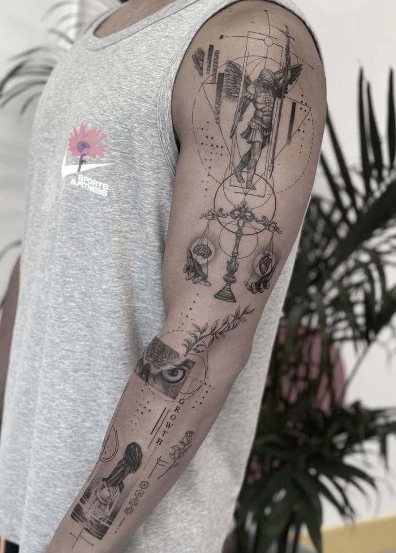 A detailed black and grey fine line tattoo on the arm featuring an angel, an eye, and scales, with intricate dotwork and geometric elements — by Jian Liang, los angeles