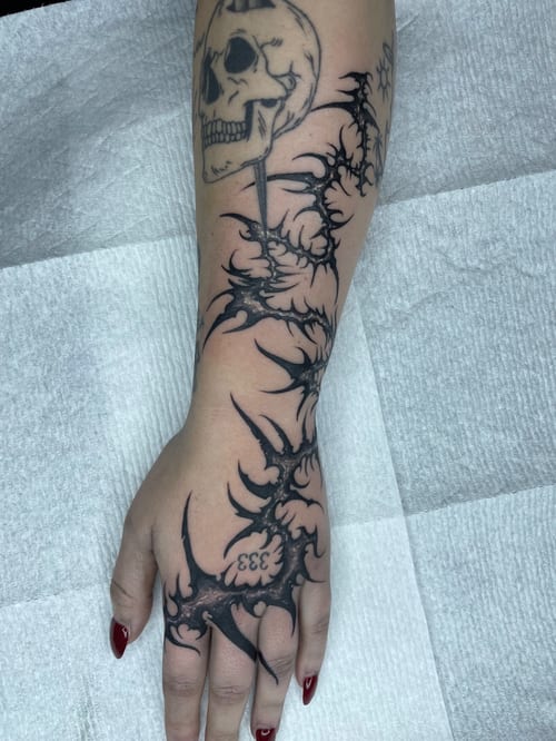 blackwork skull with barbed wire tattoo — by Vince Espinoza, los angeles