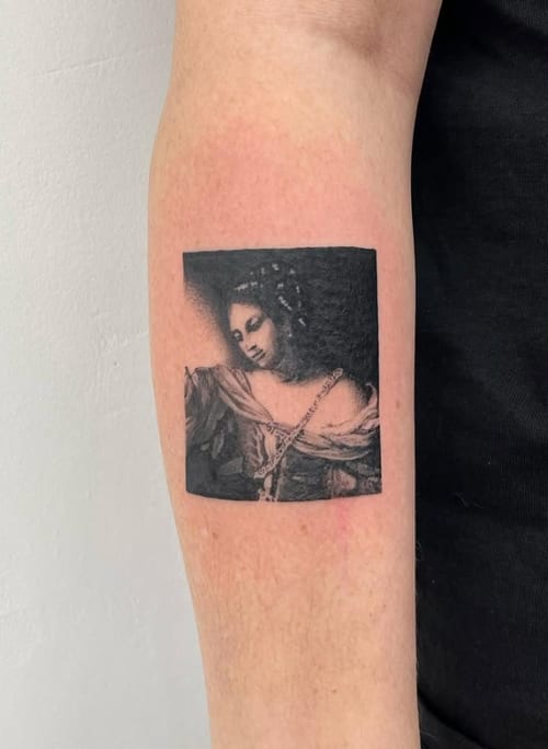 A black and grey portrait of a woman on the forearm, featuring detailed shading and a classic style — by Level tattoo, los angeles