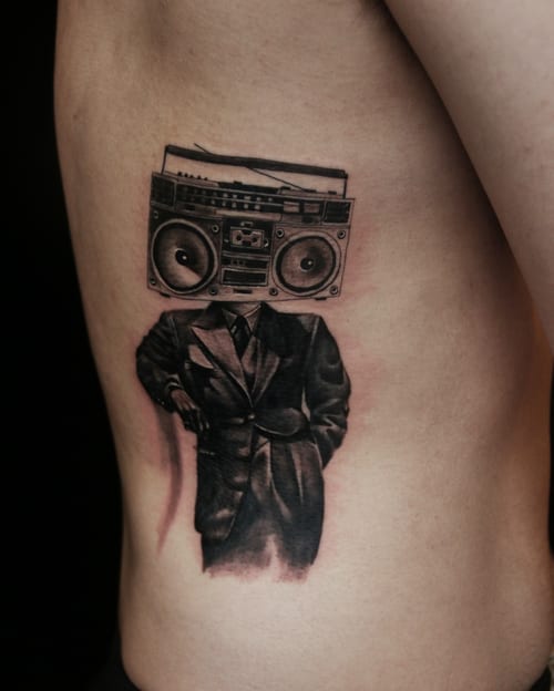 surrealism man with boombox head tattoo — by Chiu Ray, los angeles