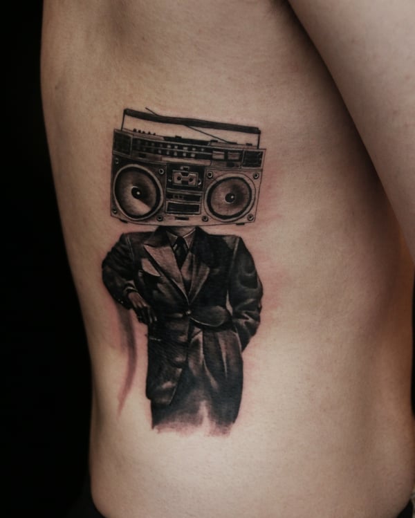 surrealism man with boombox head tattoo — by Chiu Ray, los angeles