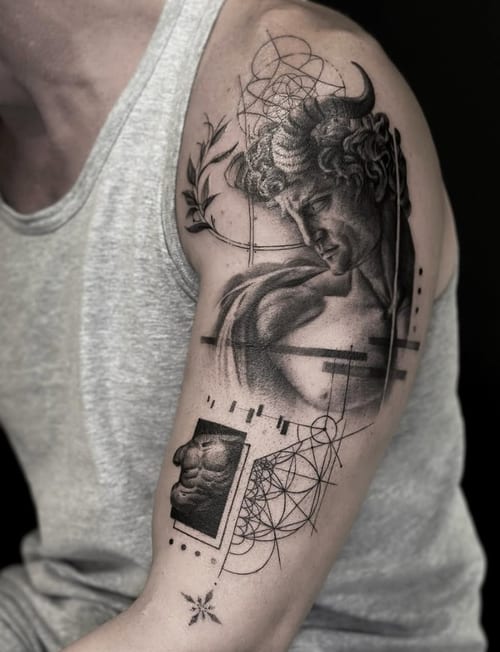 A black and grey realism tattoo of Michelangelo's David on the upper arm, featuring geometric elements and intricate shading — by Jian Liang, los angeles