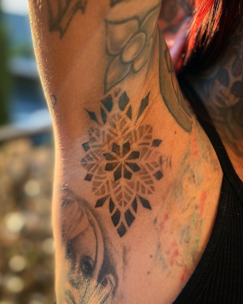 ornamental geometric blackwork mandala tattoo in solid black by Travis Ross, a blackwork tattoo artist in los angeles