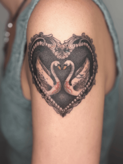 black & grey two swans forming a heart tattoo — by Samantha Wilks, los angeles