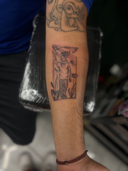 A black and grey tattoo on the forearm depicting a child holding balloons, rendered in a linework style — by Mr._Folks, los angeles