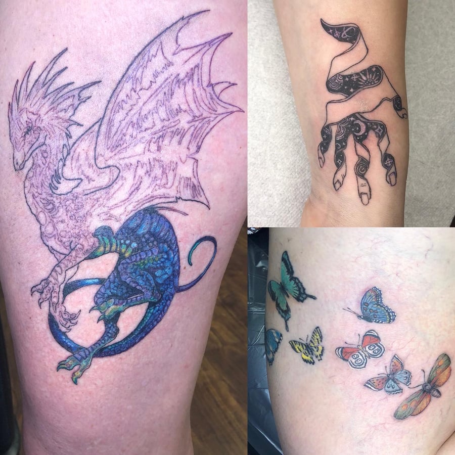 A whimsical illustrative dragon with colorful scales on the forearm, accompanied by a blackwork hand design and colorful butterflies — by Sandra Price, los angeles
