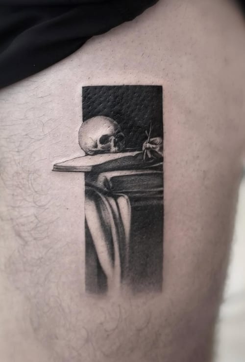 A black and grey realism tattoo of a skull on a rib, featuring detailed shading and a rectangular composition — by Jian Liang, los angeles