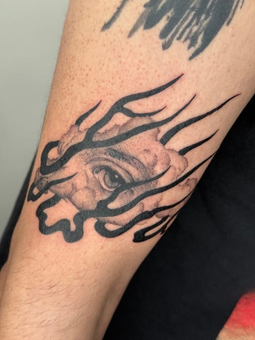 blackwork eye with abstract lines tattoo — by Level tattoo, los angeles