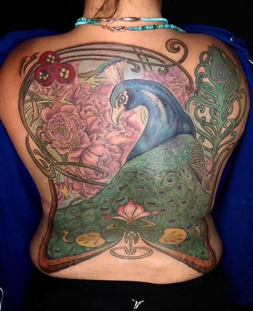 A colorful neo-traditional peacock with floral background covering the entire back, featuring ornate details and bold colors — by Sandra Price, los angeles