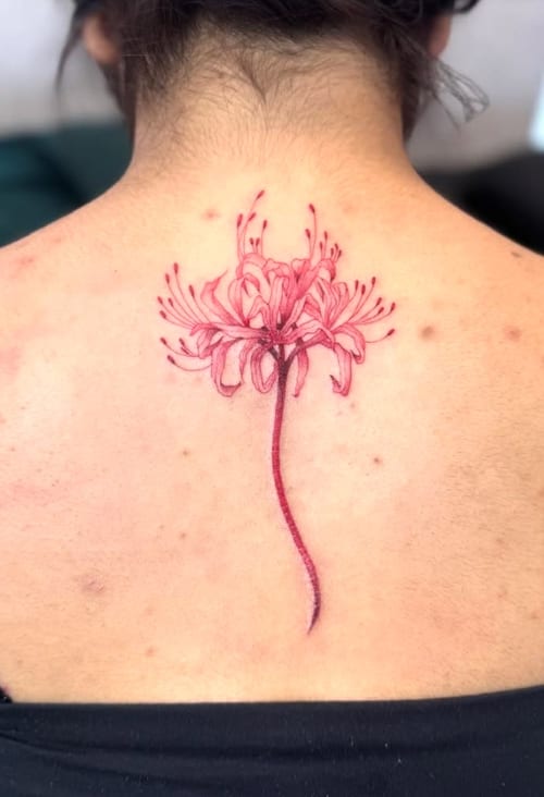 A delicate fine line tattoo of a red flower on the upper back, showcasing intricate botanical details — by otaybeatdown, los angeles